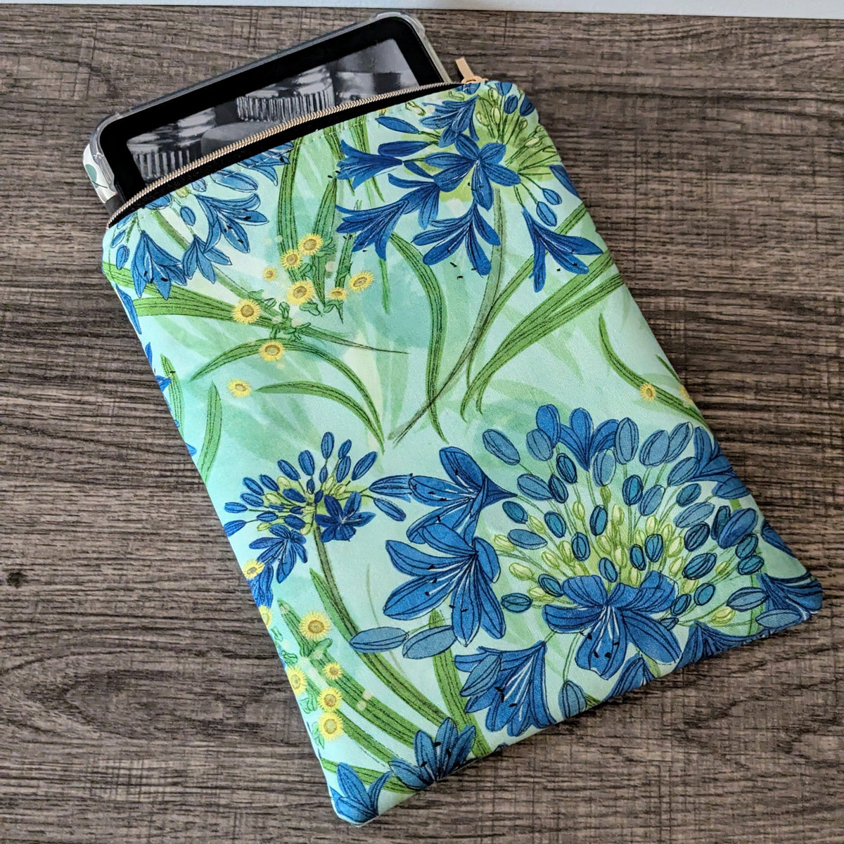 Floral-patterned pouch on a wooden surface