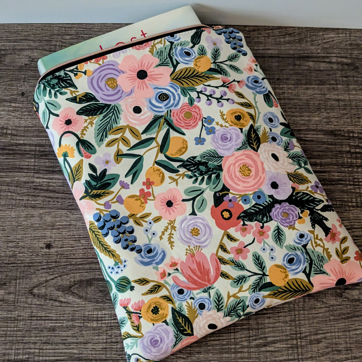 Floral-patterned notebook on a wooden surface